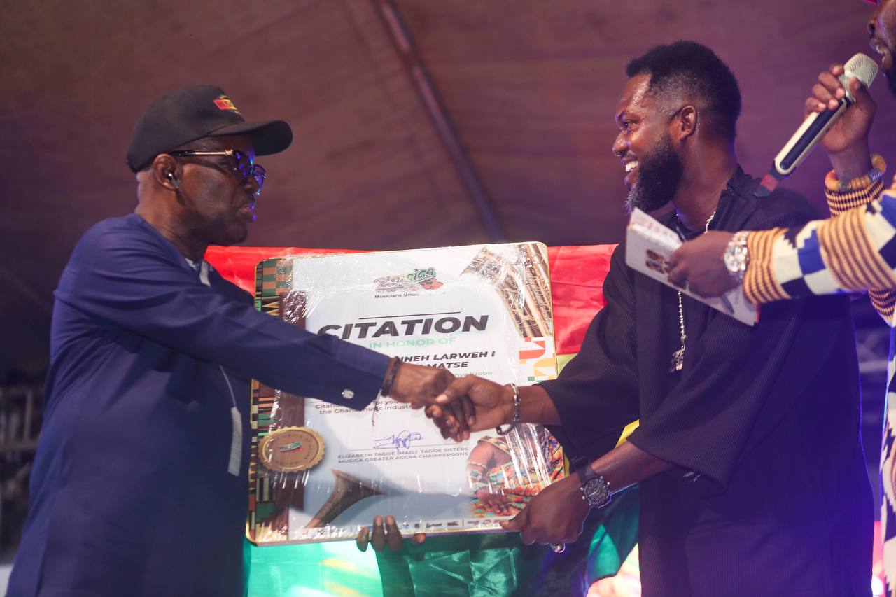 Sparqlyn smiling with trophies